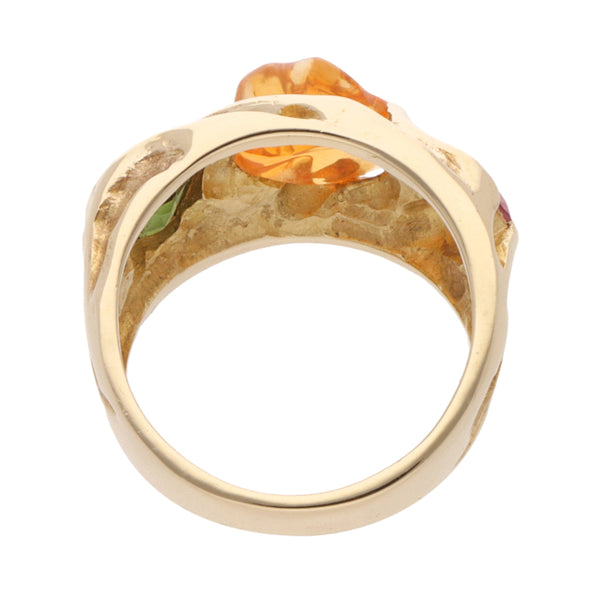 Anillo hechura especial con sintéticos en oro amarillo 14 kilates.