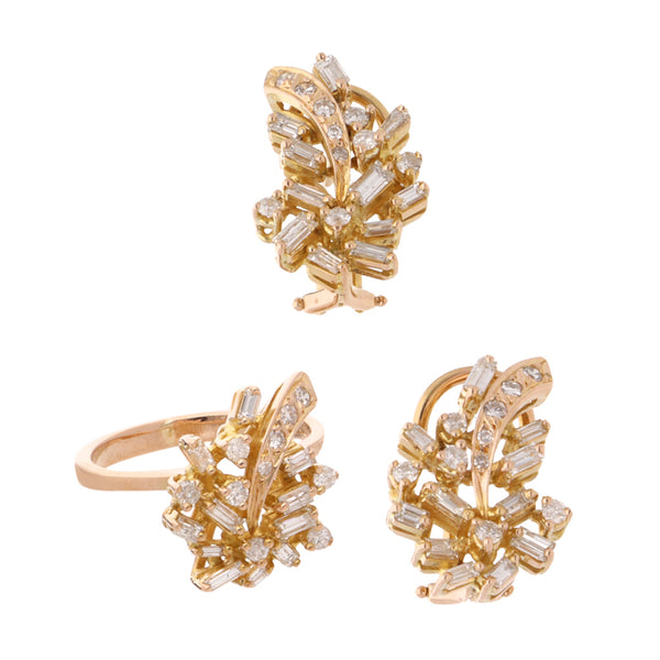 Juego de anillo y aretes hechura especial con diamantes en oro amarillo 18 kilates.