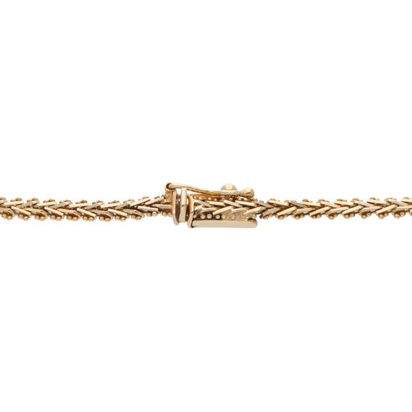 Pulsera eslabón boleado en oro amarillo 14 kilates.