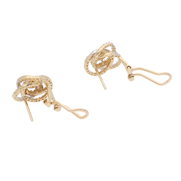 Aretes hechura especial con sintéticos en oro amarillo 14 kilates.