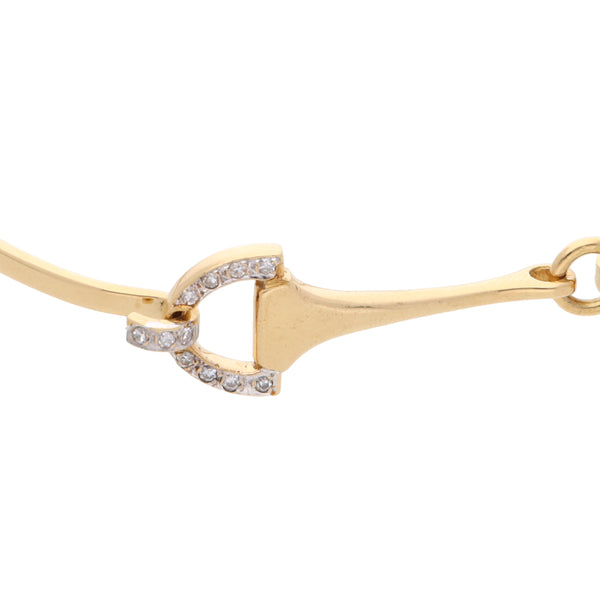 Pulsera de arillo articulada con diamantes firma Piaget en oro amarillo 18 kilates.