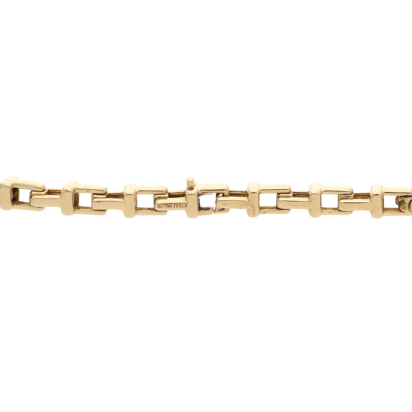 Pulsera eslabón cruzado firma Tiffany & Co. en oro amarillo 18 kilates.