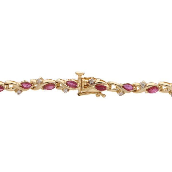 Pulsera eslabón articulado con Rubies y diamantes en oro amarillo 14 kilates.