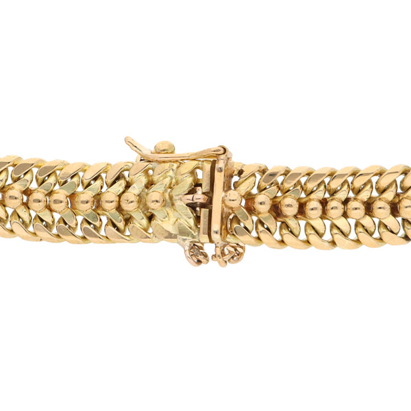 Pulsera eslabón palmeado en oro amarillo 18 kilates.