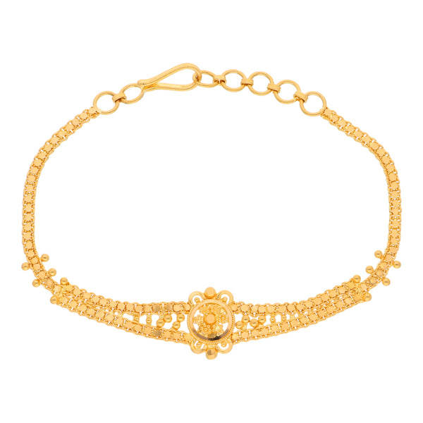 Pulsera eslabón palmeado en oro amarillo 22 kilates.