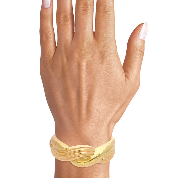 Brazalete articulado en oro amarillo 18 kilates.