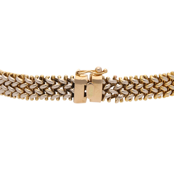 Pulsera hechura italiana en oro dos tonos 14 kilates.