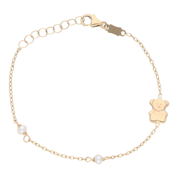 Pulsera para niña eslabón cruzado motivo oso con perlas en oro amarillo 18 kilates.