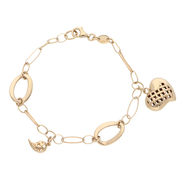 Pulsera eslabón combinado con dos dijes motivo corazón y medio corazón en oro amarillo 14 kilates.