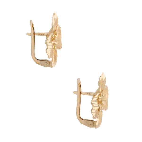 Aretes hechura especial motivo flor en oro amarillo 14 kilates.