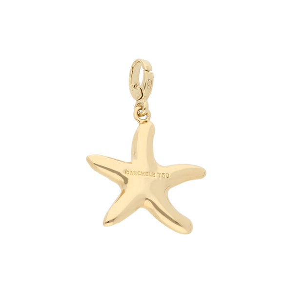 Dije hechura especial con sintético motivo estrella de mar firma Michele en oro amarillo 18 kilates.