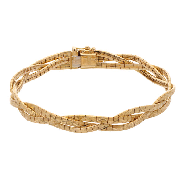 Pulsera eslabón planchado trenzado en oro amarillo18 kilates.