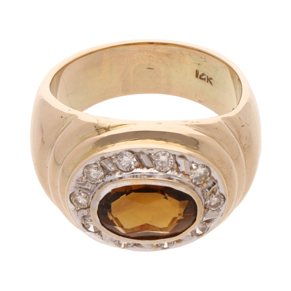 Anillo diseño especial con diamantes y sintético en oro dos tonos 14 kilates.