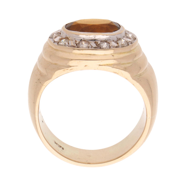 Anillo diseño especial con diamantes y sintético en oro dos tonos 14 kilates.