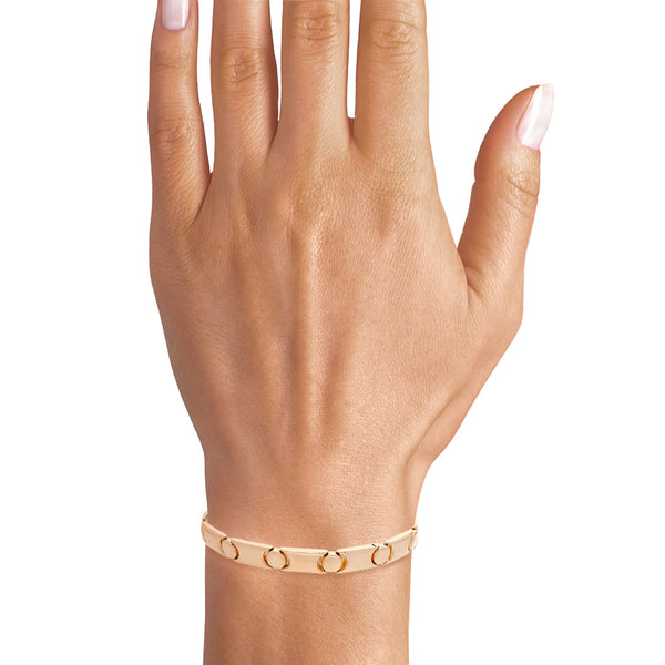 Juego de pulsera articulada y anillo motivo tornillos simulados en oro dos tonos 14 kilates.