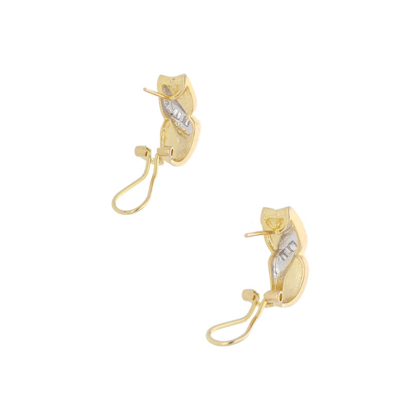 Aretes estilizados con diamantes en oro dos tonos 14 kilates.