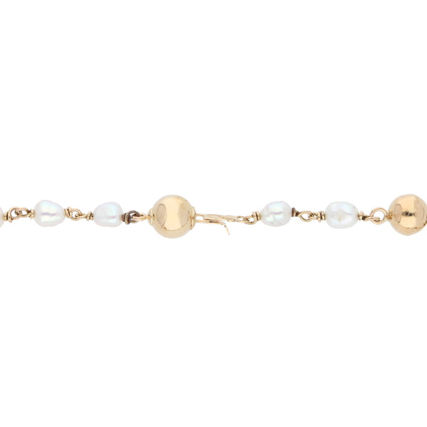 Pulsera tipo rosario con eslabón combinado y perlas en oro amarillo 14 kilates.