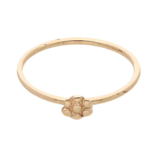 Anillo tubular motivo flor en oro amarillo 14 kilates.