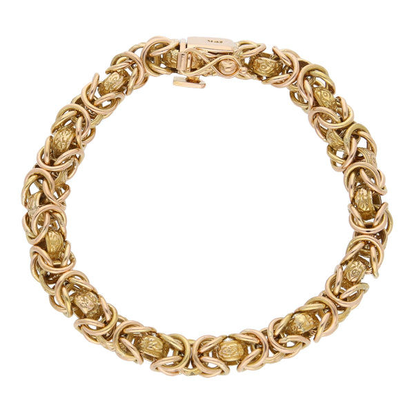 Pulsera eslabón combinado en oro amarillo 18 kilates.