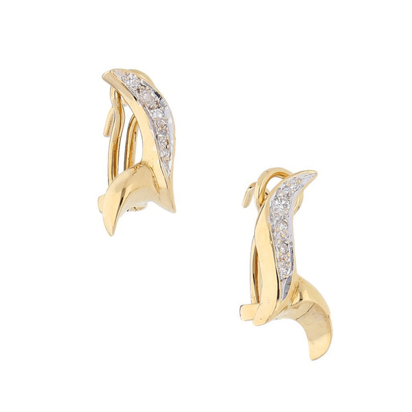 Aretes estilizados con diamantes en oro dos tonos 18 kilates.