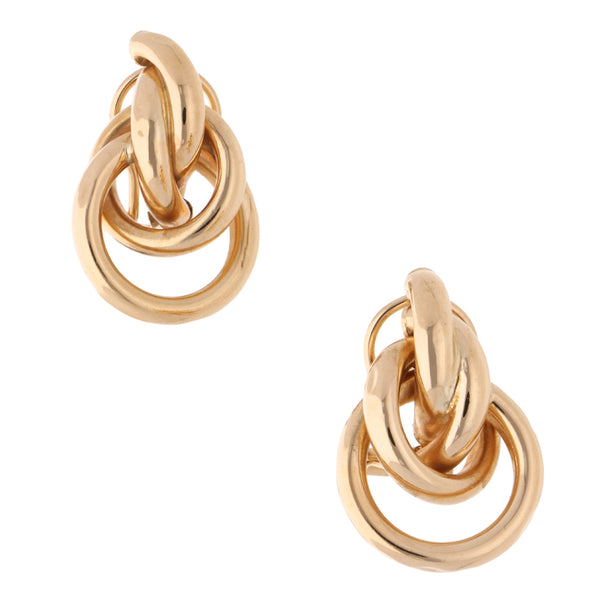 Aretes tubulares huecos en oro amarillo 14 kilates.