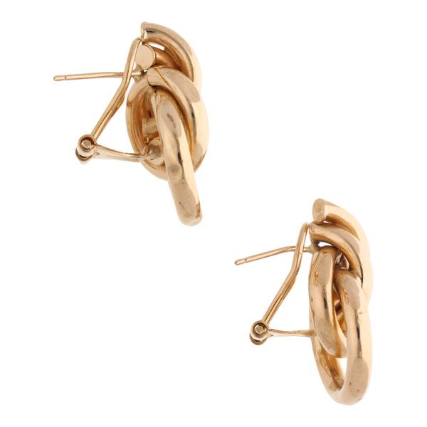 Aretes tubulares huecos en oro amarillo 14 kilates.