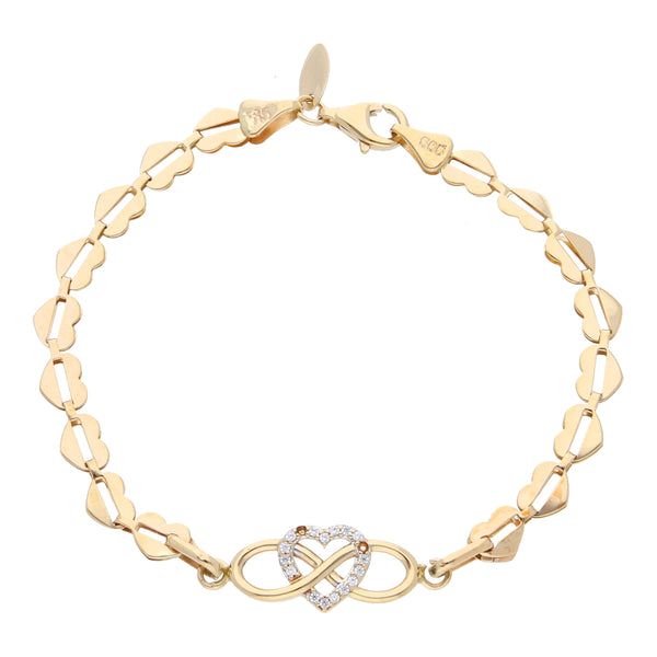 Pulsera eslabón laminado motivo corazones con sintéticos en oro amarillo 14 kilates.