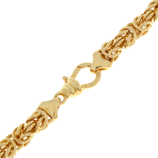 Juego de gargantilla y pulsera eslabón combinado en oro amarillo 14 kilates.