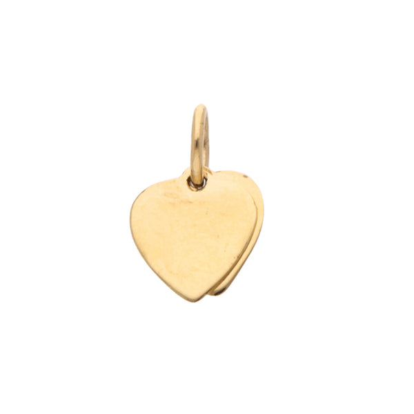 Dije diseño especial motivo corazones con sintético en oro amarillo 18 kilates.