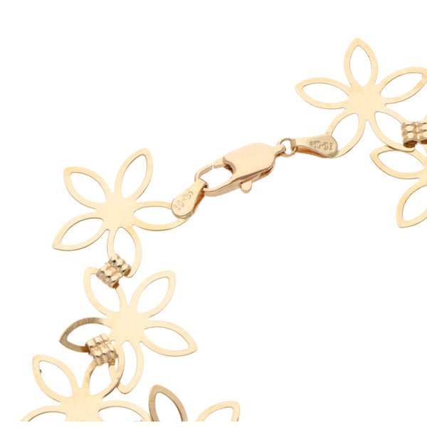 Pulsera eslabón encontrado motivo flor en oro amarillo 14 kilates.