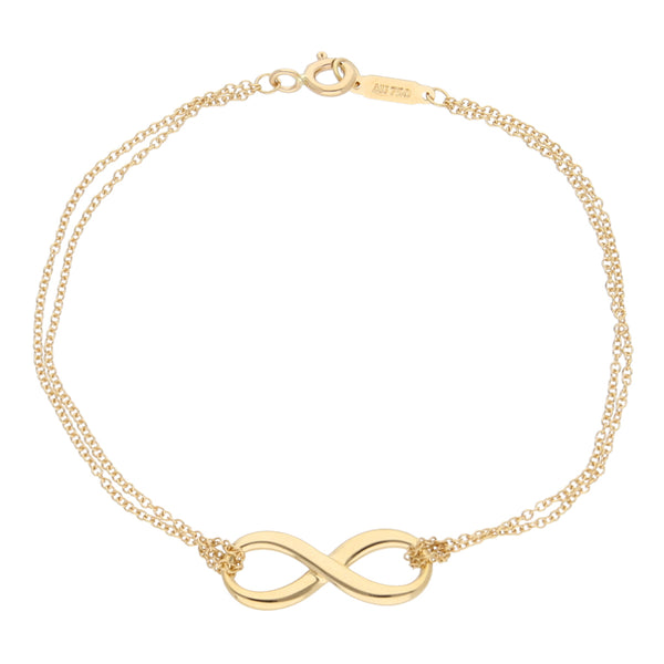 Pulsera dos hilos eslabón cruzado motivo infinito firma Tiffany & Co. en oro amarillo 18 kilates.