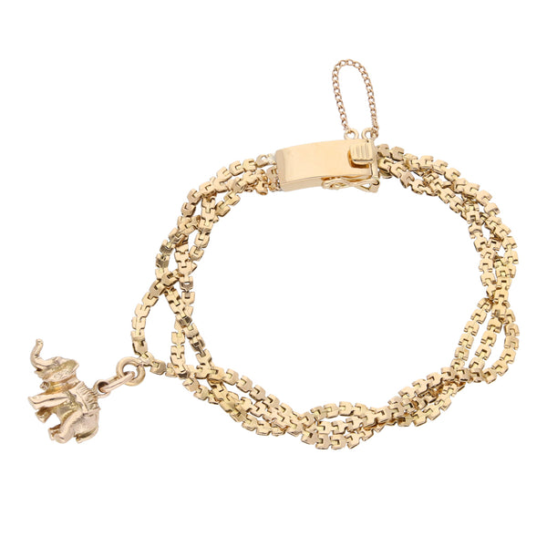 Pulsera eslabón laminado trenzado con dije motivo elefante en oro amarillo 18 kilates.