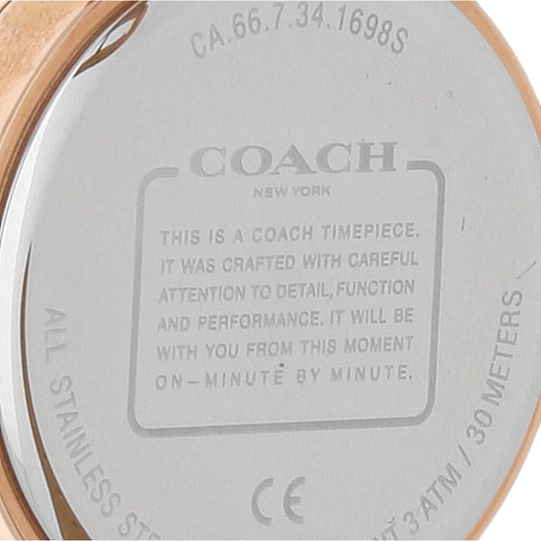 Reloj Coach para dama en acero chapa correa piel.