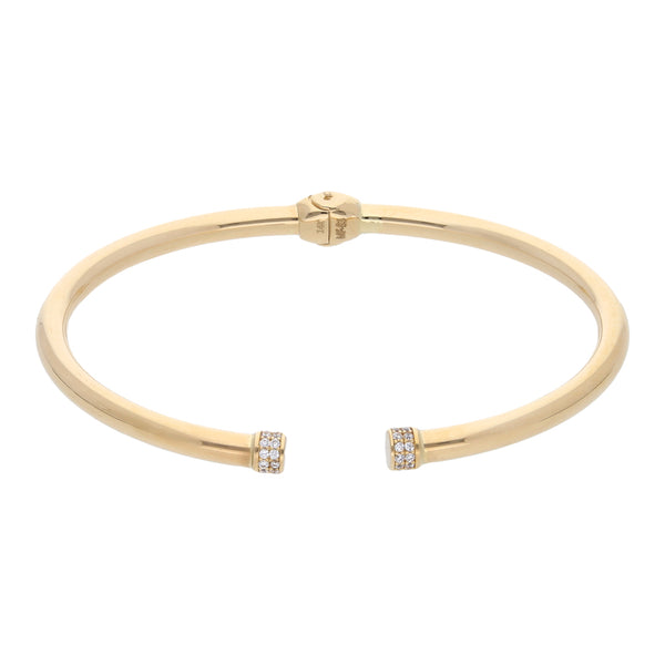 Pulsera de arillo abierta con sintéticos en oro amarillo 14 kilates.