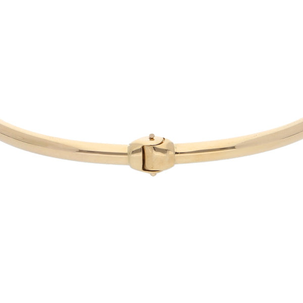 Pulsera de arillo abierta con sintéticos en oro amarillo 14 kilates.