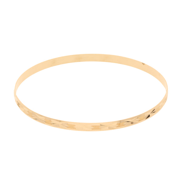 Pulsera de arillo labrada en oro amarillo 14 kilates.