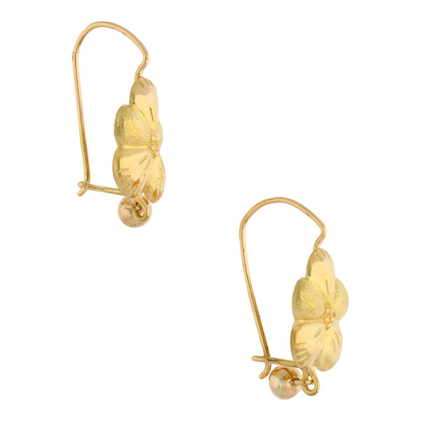 Aretes laminados motivo flor en oro amarillo 18 kilates.