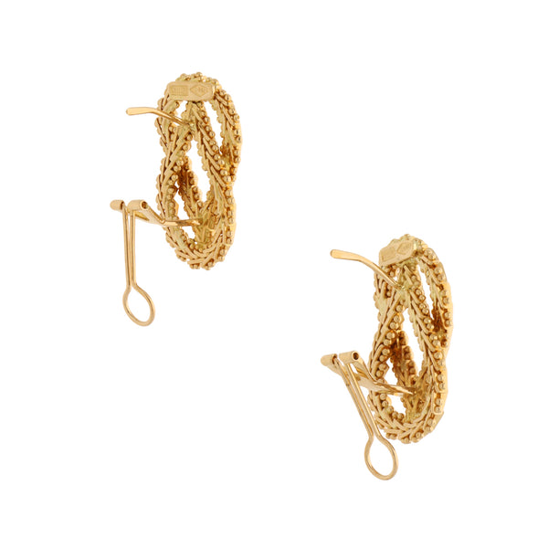 Aretes boleados en oro amarillo 18 kilates.