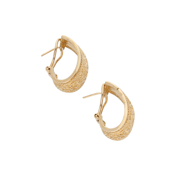 Aretes labrados en oro amarillo 14 kilates.