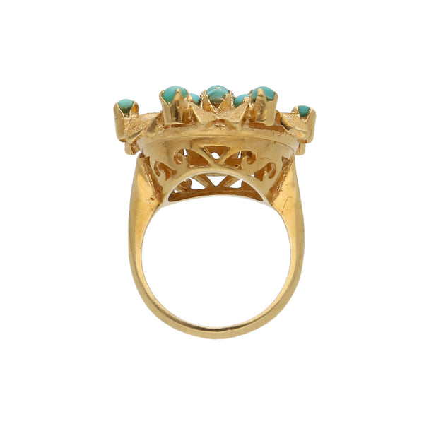 Anillo calado motivo floral con turquesas en oro amarillo 18 kilates.