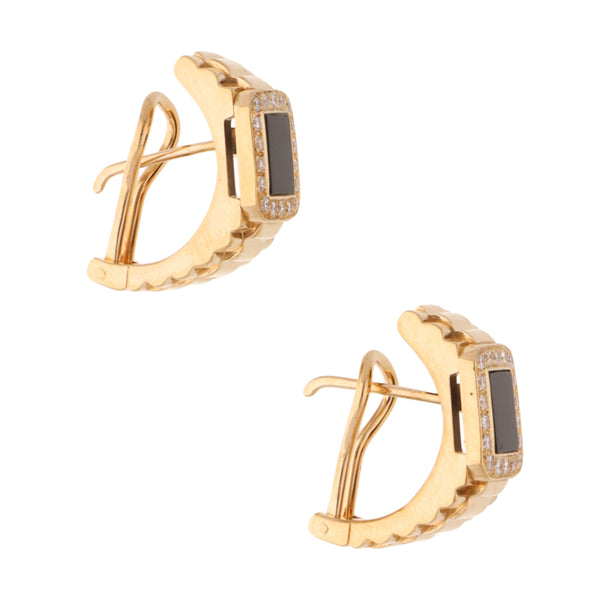 Aretes diseño especial con ónix y diamantes en oro amarillo 18 kilates.