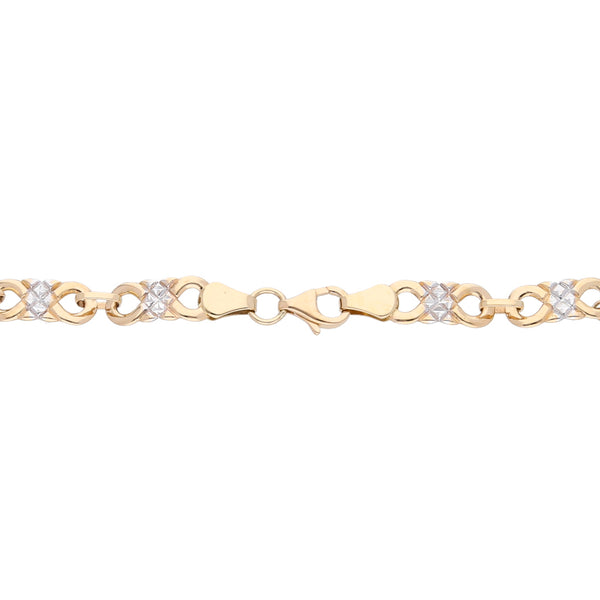 Pulsera eslabón combinado diamantado en oro amarillo 14 kilates.