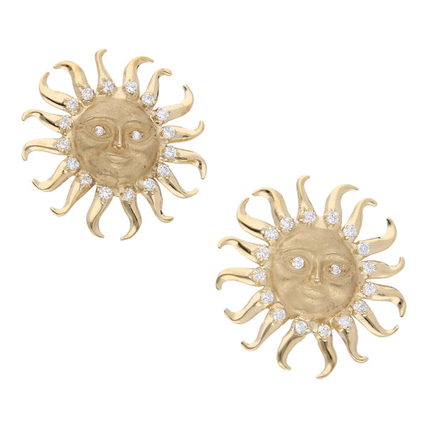 Aretes estilizados motivo sol con circonias en oro amarillo 14 kilates.