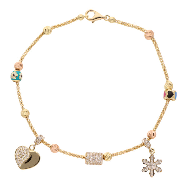 Pulsera eslabón combinado con dijes, esmalte y circonias en oro amarillo 14 kilates.