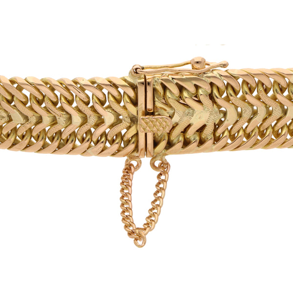 Pulsera eslabón palmeado en oro amarillo 18 kilates.