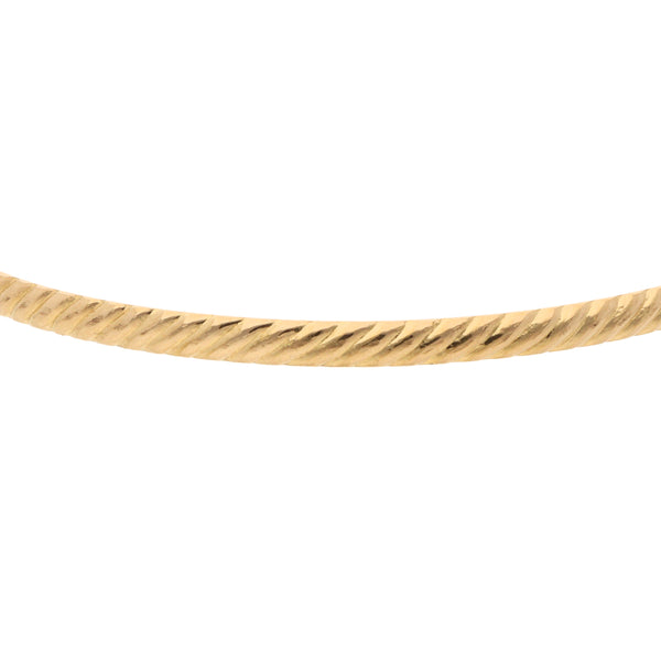 Pulsera de arillo acanalada en oro amarillo 18 kilates.