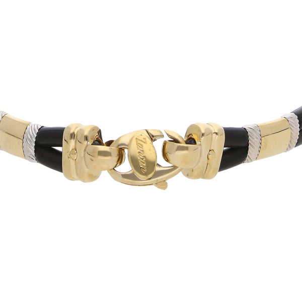 Pulsera diseño especial en caucho firma Zancan con diamantes y aplicaciones en oro dos tonos 18 kilates.