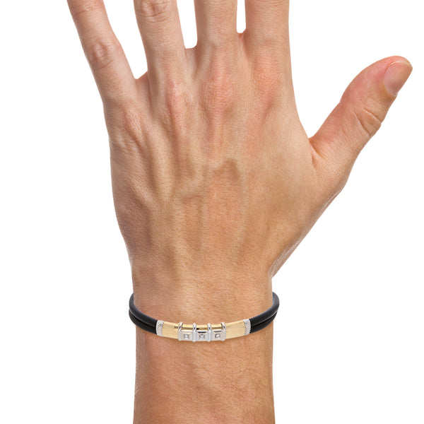 Pulsera diseño especial en caucho firma Zancan con diamantes y aplicaciones en oro dos tonos 18 kilates.