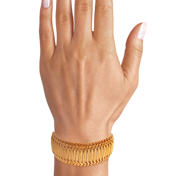 Brazalete eslabón combinado en oro amarillo 18 kilates.