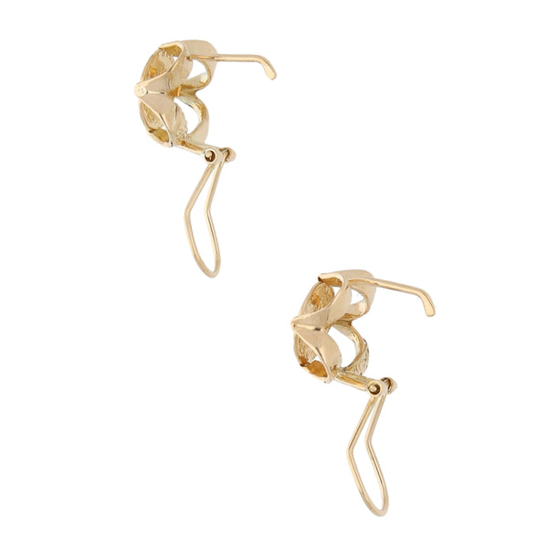 Aretes calados en oro amarillo 14 kilates.